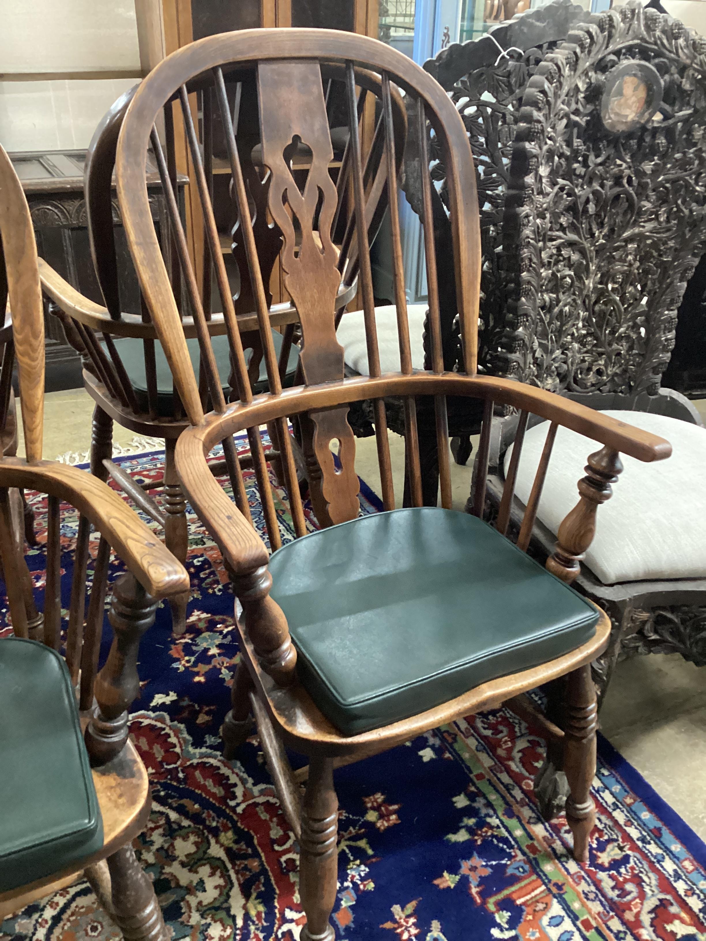 A set of six 19th century ash and elm Windsor armchairs with H stretchers and later leatherette squab seats, width 58cm, depth 38cm, height 116cm